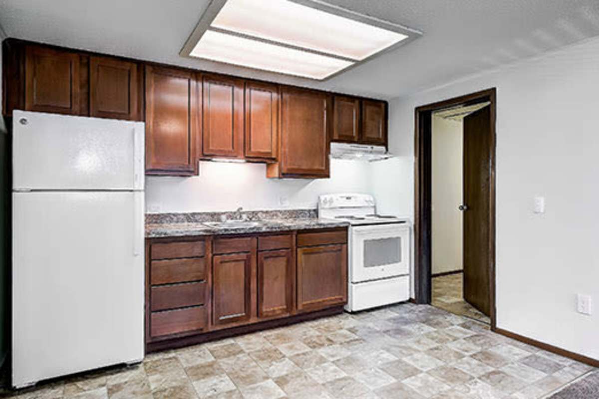 Kitchen with appliances at Little Brook Apartments in Frederick, Maryland