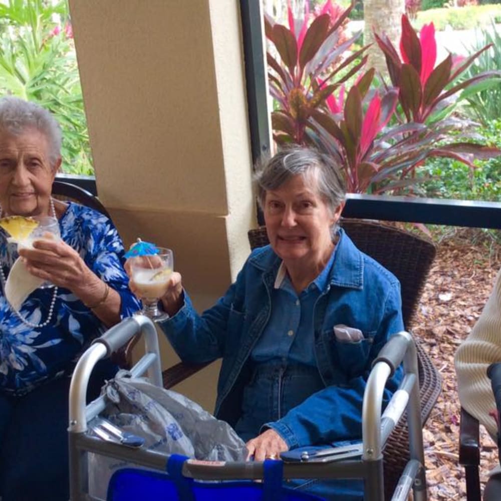 Resident smiling at the camera at Inspired Living Sarasota in Sarasota, Florida.