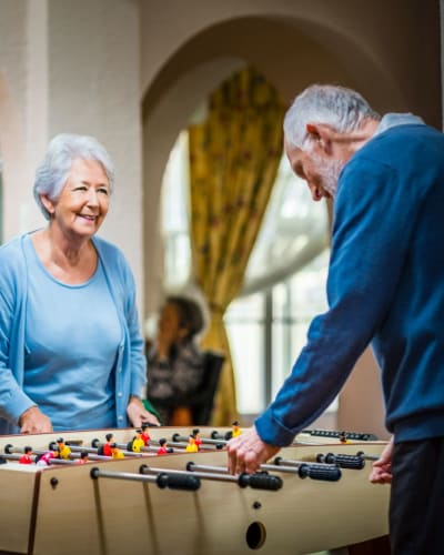 Residents playing foosball nearby Trustwell Living at Westwood Place in Woodsfield, Ohio