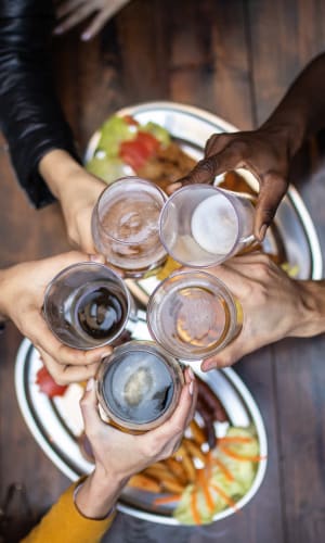 Residents raising a toast at a restaurant near Dove Hollow Apartments in Allen, Texas