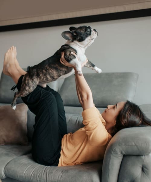 Resident playing with her dog at Victoria Station in Victoria, Texas