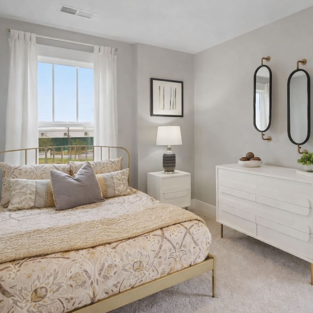 Bedroom with bed and side lamp at The Wilds at Cedar Mountain in Asheville North Carolina
