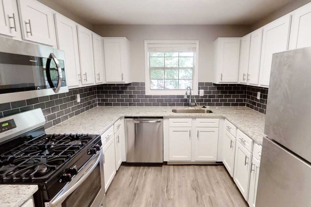 Fully-equipped kitchen with stainless-steel appliances at Preserve at Dunwoody in Dunwoody, Georgia