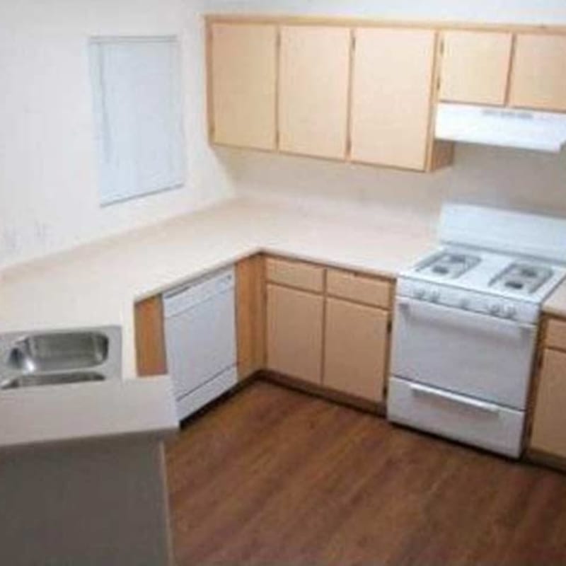 Kitchen with white appliances at Sommerset Place in Sacramento, California