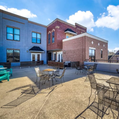 Tables and chairs on the roof deck at Square9 in Denton, Texas