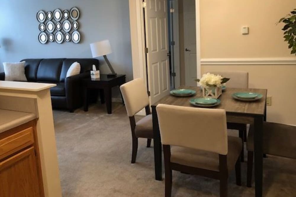 A set table in a dining room at Aspen Pines Apartment Homes in Wilder, Kentucky