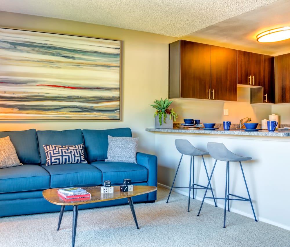 Retro-modern decor in the living area near the breakfast bar of a model home at Sofi Belmont Hills in Belmont, California