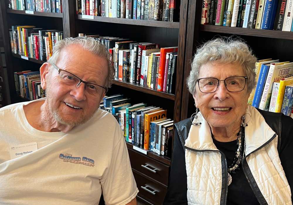 Resident couple posing in their home at Merrill Gardens at Tacoma in Tacoma, Washington