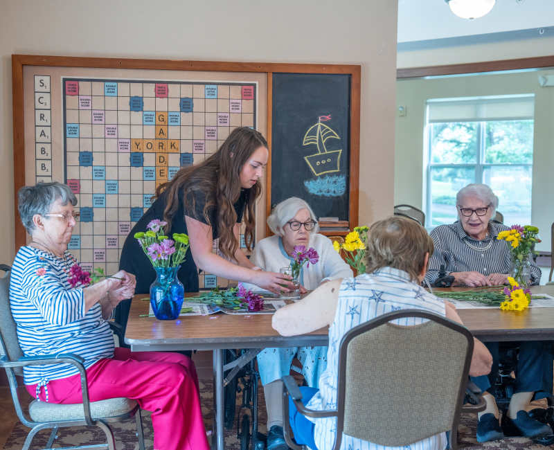Caretaker taking a residents order at York Gardens in Edina, Minnesota