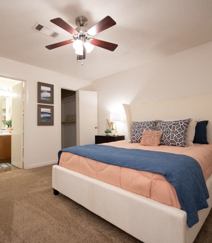 Spacious carpeted bedroom at The Mark Apartments in Ridgeland, Mississippi