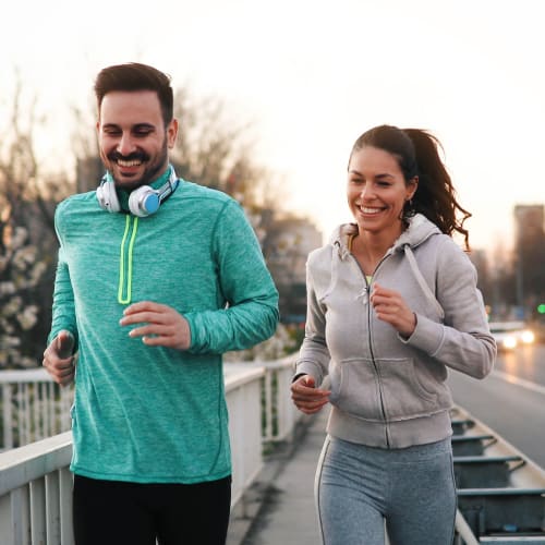 Couple jogging in Clarkston, Georgia near Reserve at Twin Oaks