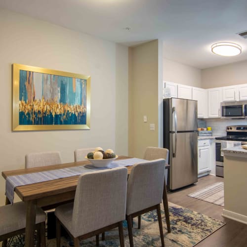 Room next to kitchen with a painting at River Forest in Chester, Virginia