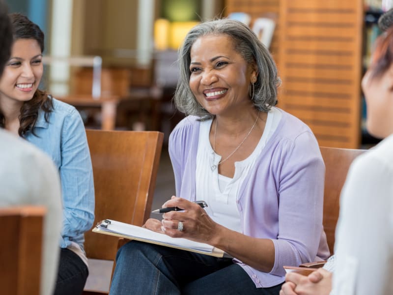 A smiling staff member at Garden Place Waterloo in Waterloo, Illinois. 