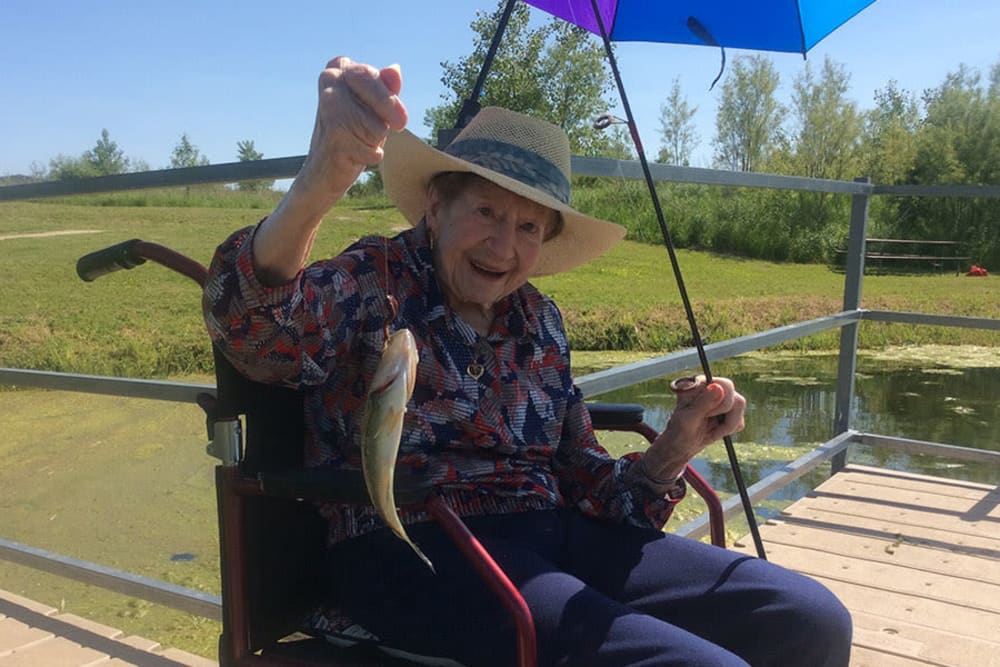Resident MaryLou fishes in the pond at Clover Ridge Place in Maquoketa, Iowa.