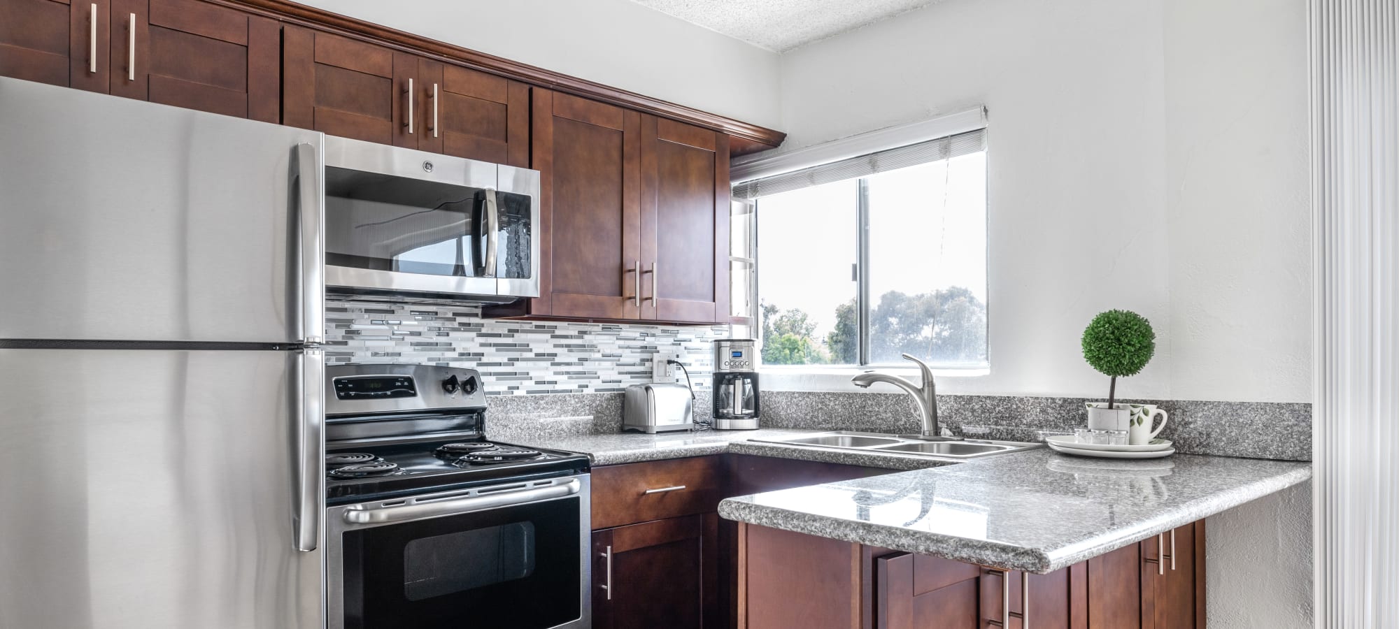 Kitchen with stainless-steel appliances at Playa Pacifica, Playa Del Rey, California