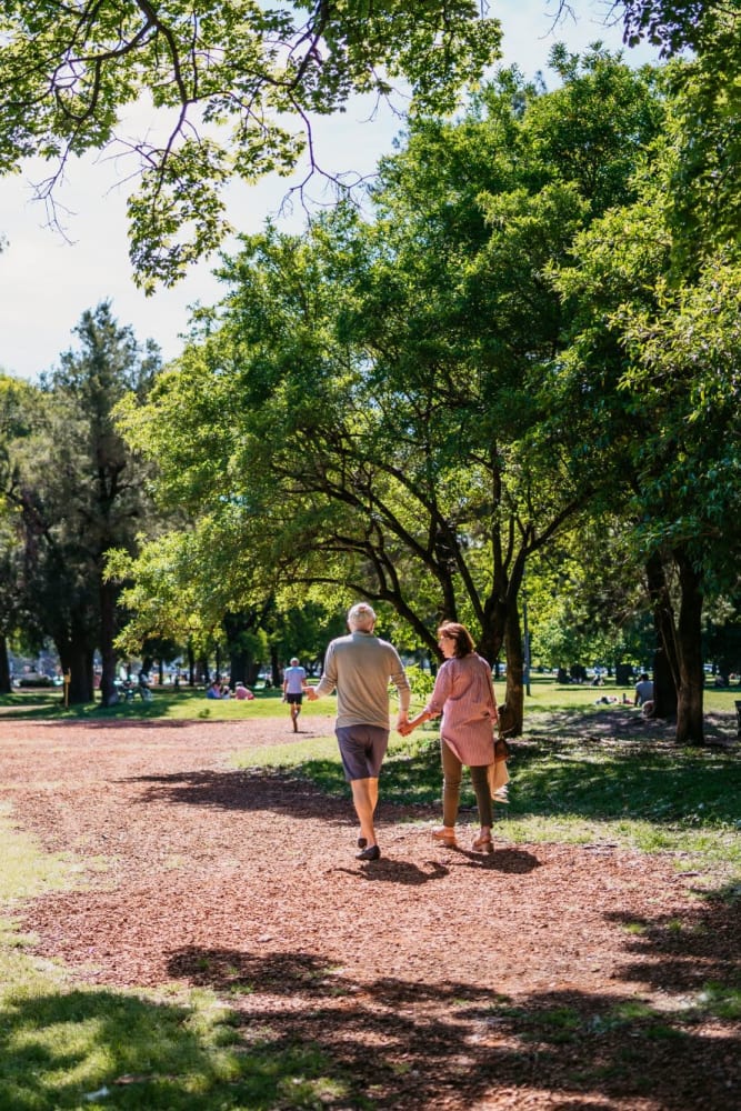 Walking in the park near The Olympian Apartments in Olympia, Washington