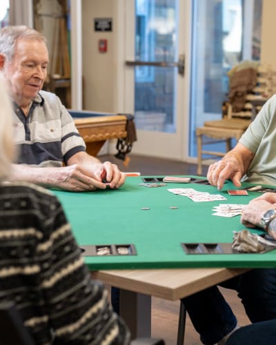 Group of residents playing poker at The Views at Lake Havasu in Lake Havasu City, Arizona