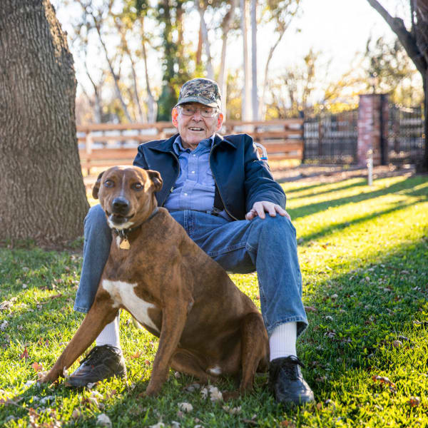 A man and his dog at The Atrium at Carmichael in Carmichael, California