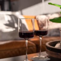 Wine glasses by couch at Lafayette Oaks in Lafayette, California