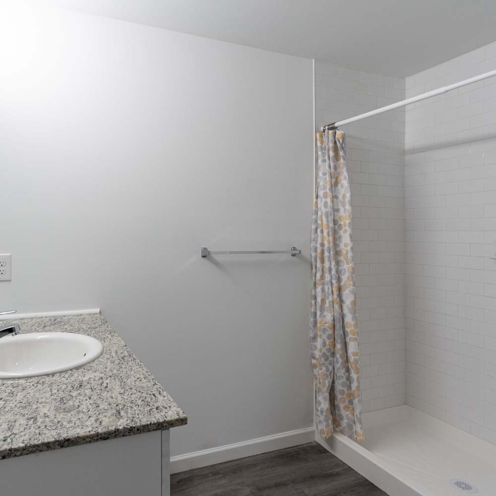 A shower and a tub in a bathroom at Park Canyon in Dalton, Georgia
