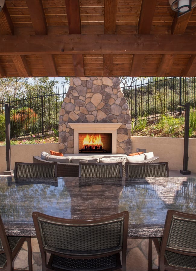 Cabana with a large table for entertaining guests at Shadow Ridge Apartment Homes in Simi Valley, California