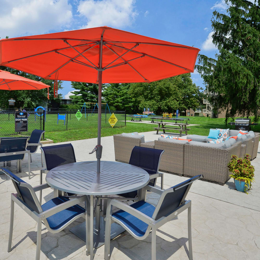 Outdoor lounge area and patio tables at Briarwood Apartments & Townhomes in State College, Pennsylvania