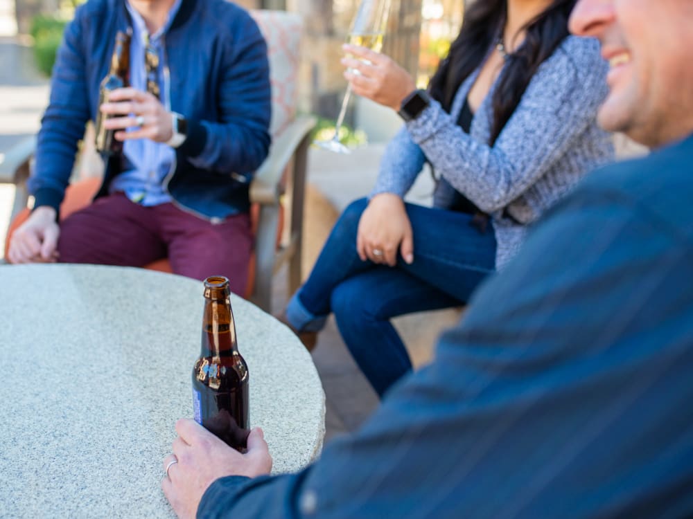 Residents enjoying drinks at one of the outdoor common areas at Shadow Hills at Lone Mountain in Las Vegas, Nevada