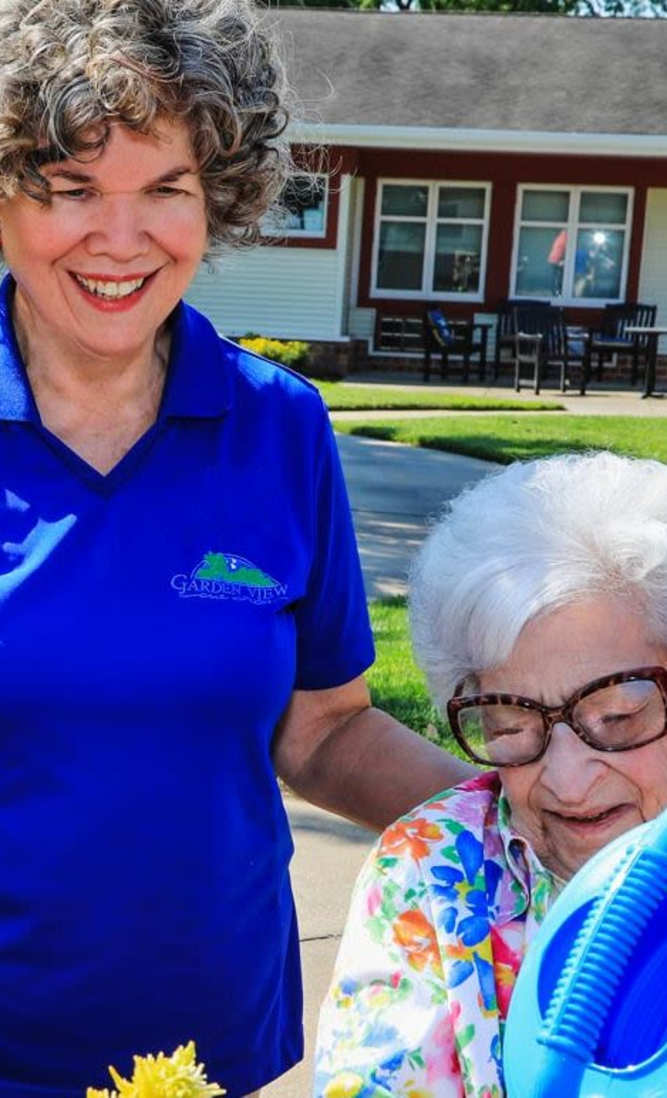 Resident talking with staff at Garden View Care Center in St. Louis, MO