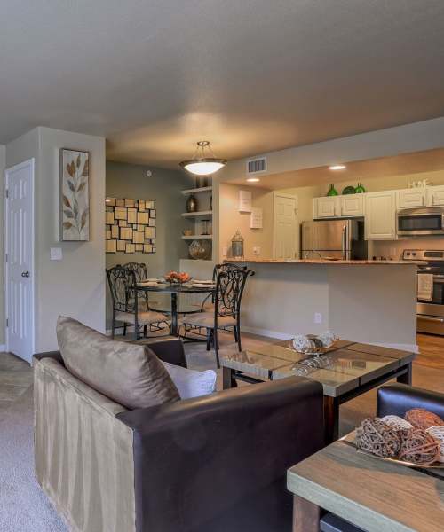 View of living space and kitchen at UTE Creek Apartments in Longmont, Colorado