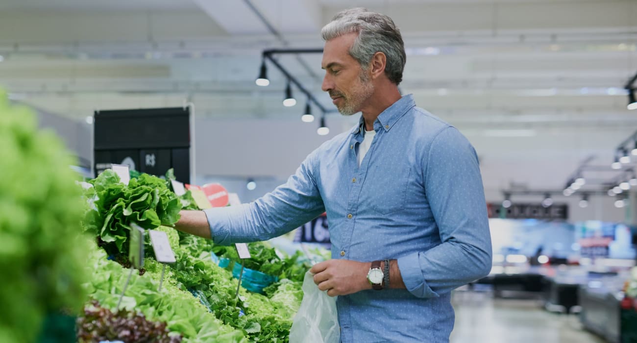 Resident shopping for produce in Reading, Pennsylvania near Carsonia Manor