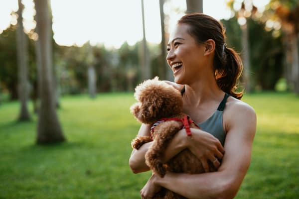 A lady holding her puppy near Crest at East Cobb in Marietta, Georgia