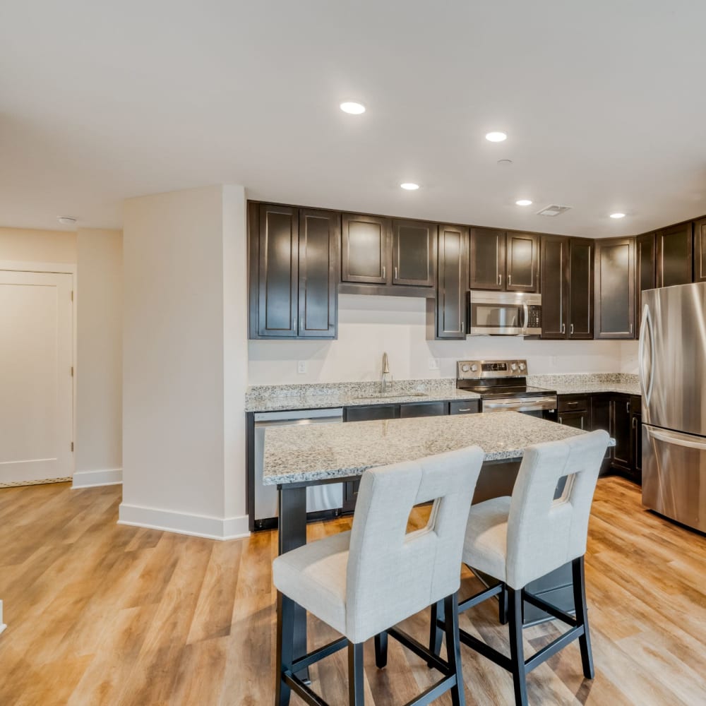 Spacious kitchen with wood-style floor at Fox Plan Apartments, Monroeville, Pennsylvania