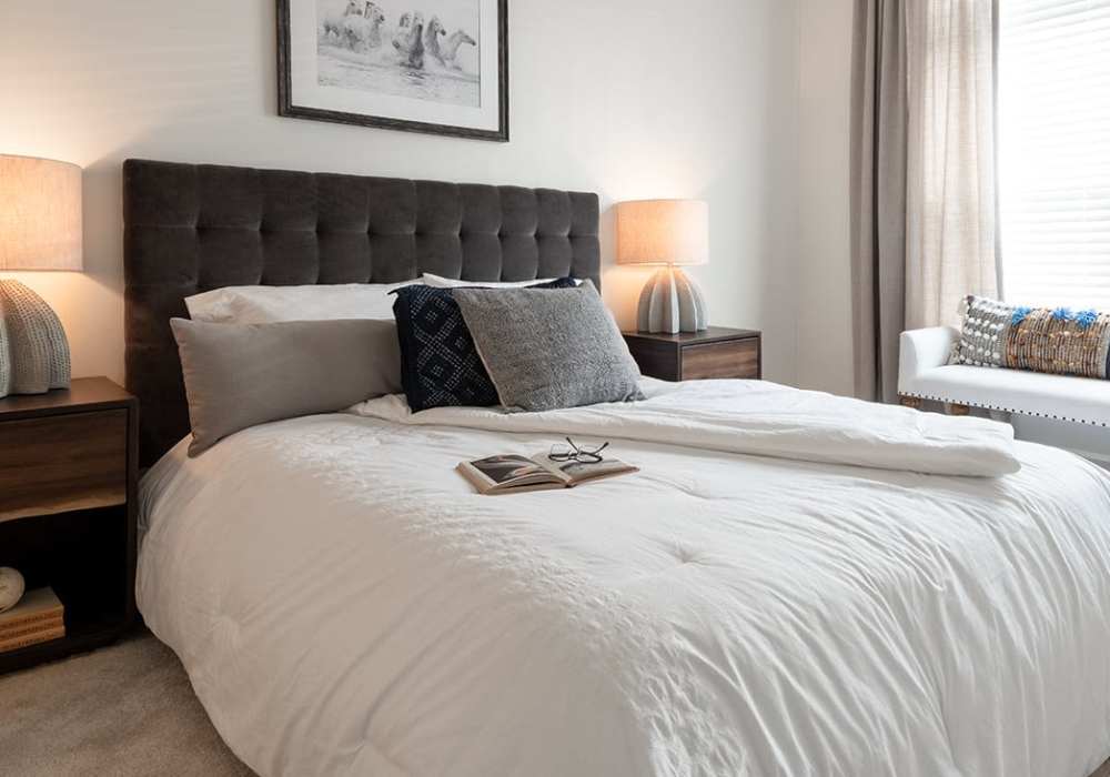 Bedroom with natural light at The Heron Downtown in Baton Rouge, Louisiana
