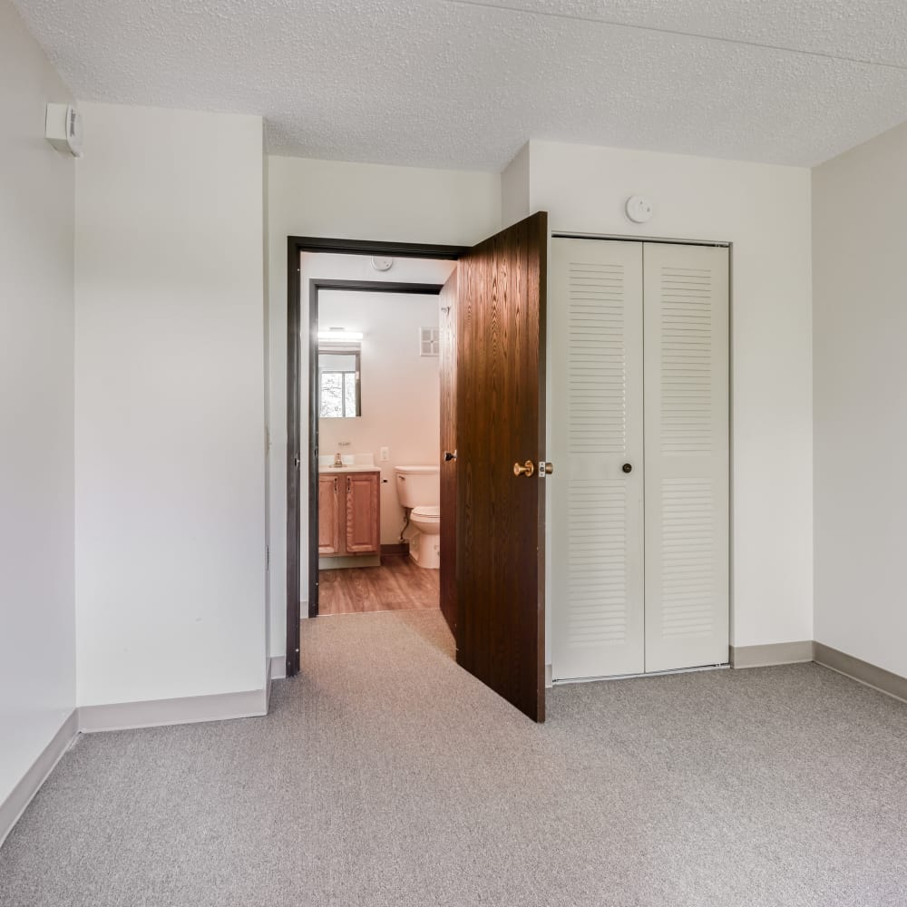 Spacious carpeted bedroom at Mable H Kehres Apartments in Monroe, Michigan