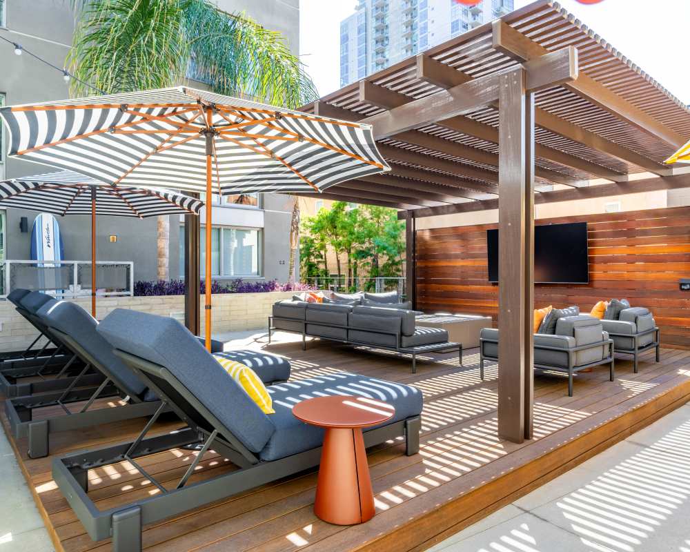 Outdoor sitting lounge at Nova Apartment Homes in San Diego, California