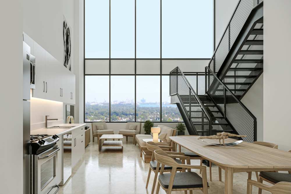 Open-concept kitchen, dining area and living room at The Bank Tower in Southgate, Michigan