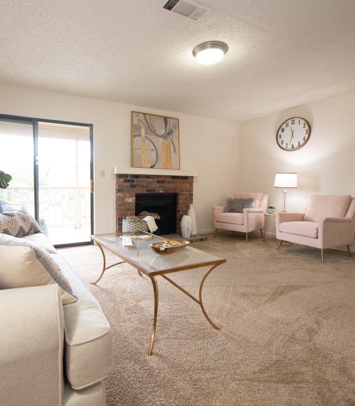 Carpeted living room at The Mark Apartments in Ridgeland, Mississippi