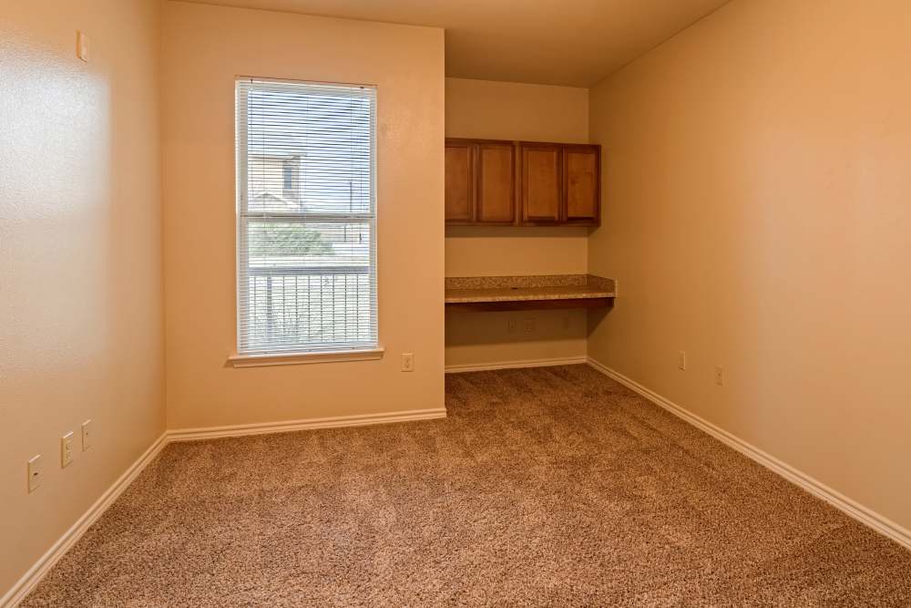 Apartment bedroom with built-in desk space at Blue Ridge in Midland, Texas