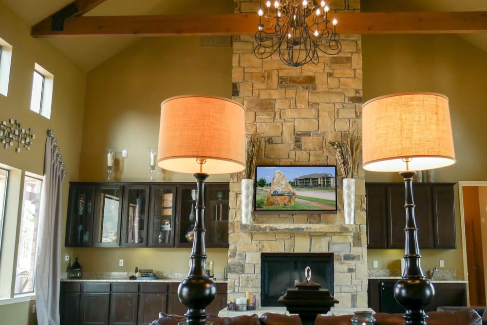 Stone fireplace in the cozy clubroom at Anatole on MacArthur in Oklahoma City, Oklahoma