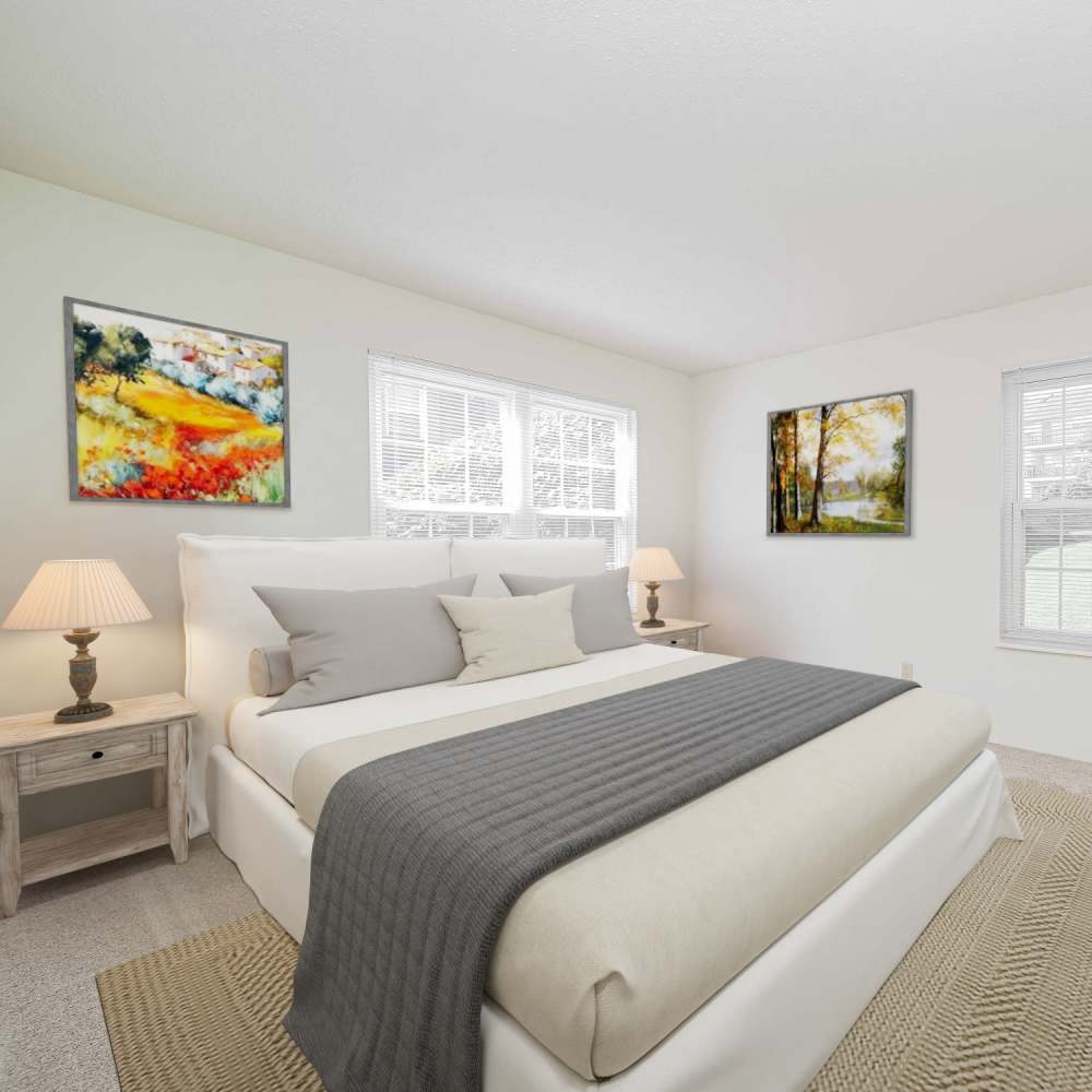 Cozy bedroom at Village Green Apartments in Chesterfield, Missouri