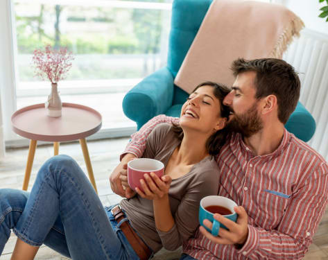 Couple enjoying coffee in their apartment at Hamilton Crossing in White Plains, New York