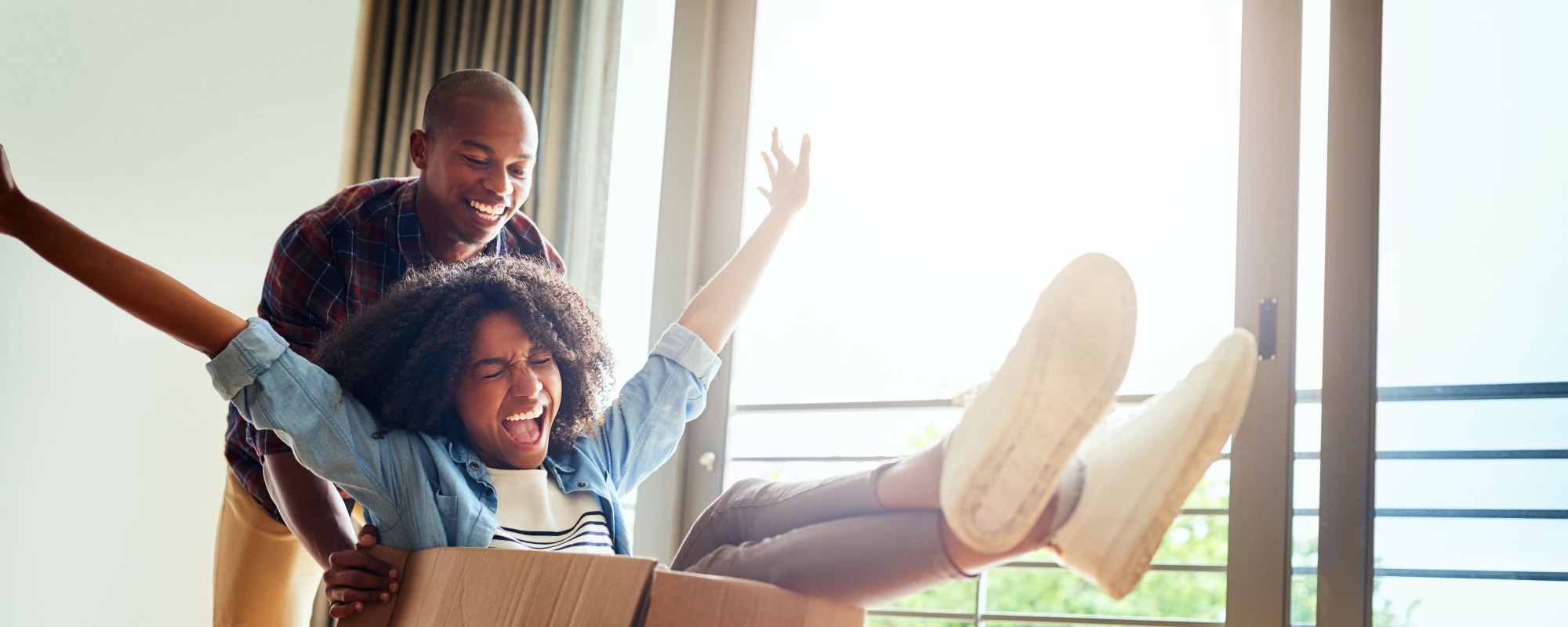 Couple having fun moving boxes at A3 Storage Centers in San Antonio, Texas