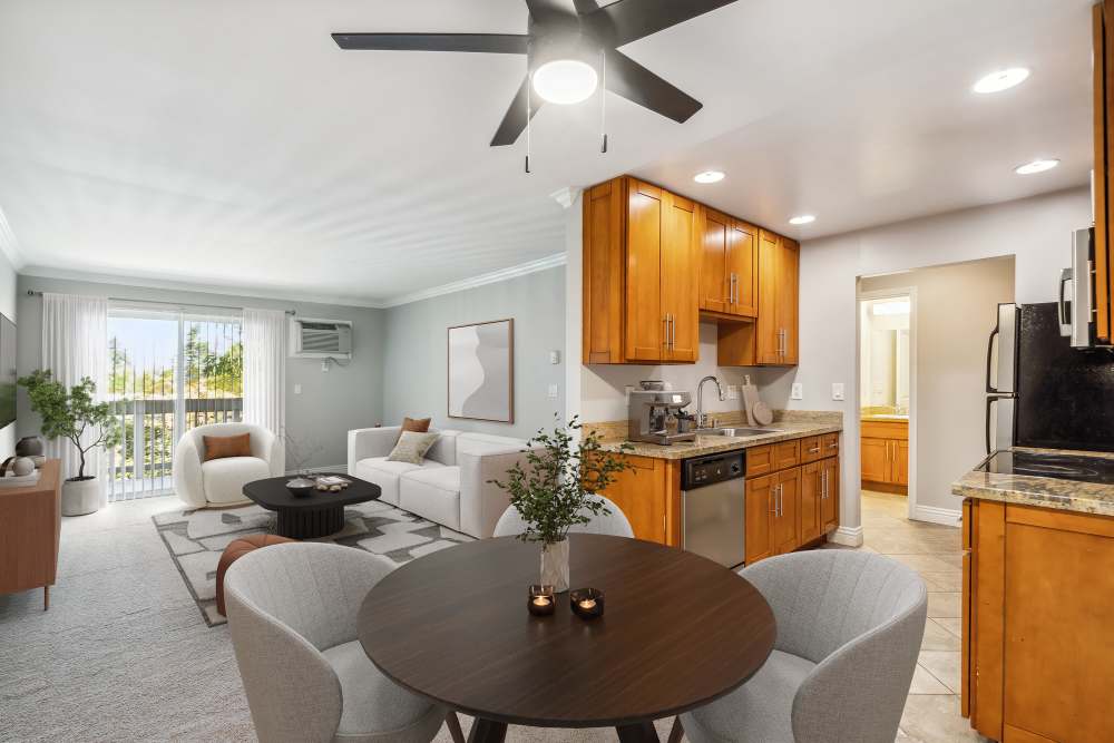 Kitchen with connecting living room at Regency Plaza Apartment Homes in Martinez, California