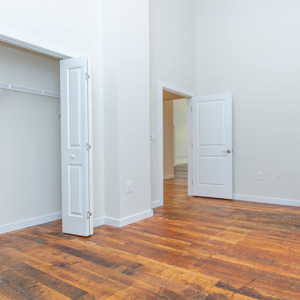 Spacious and well-lit bedroom at Lofts at Inman Mills in Inman, South Carolina