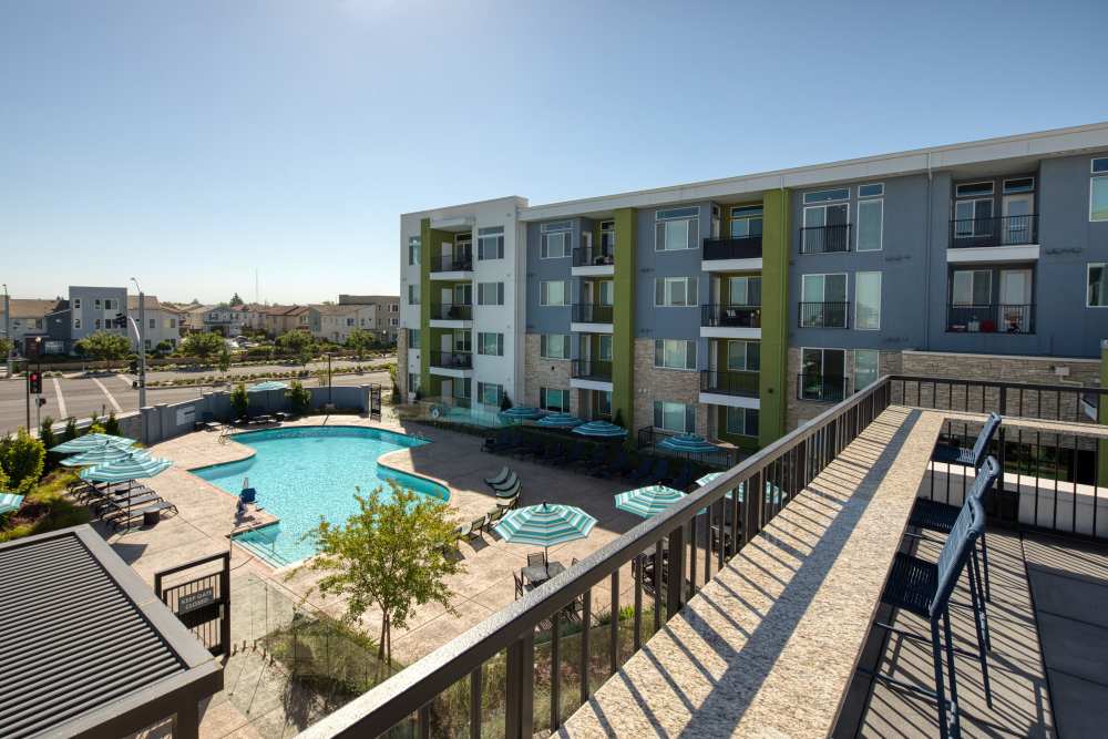 Outdoor area view to pool at Zeta Luxury Apartments in Sacramento, California