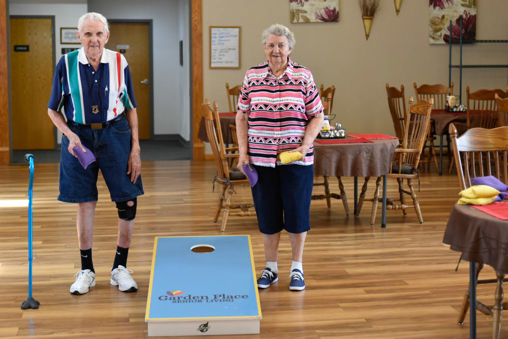 Residents playing cornhole at Garden Place Red Bud in Red Bud, Illinois