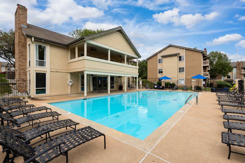 Large swimming pool with lounge chairs at Waterford Manors in Manchester, Missouri