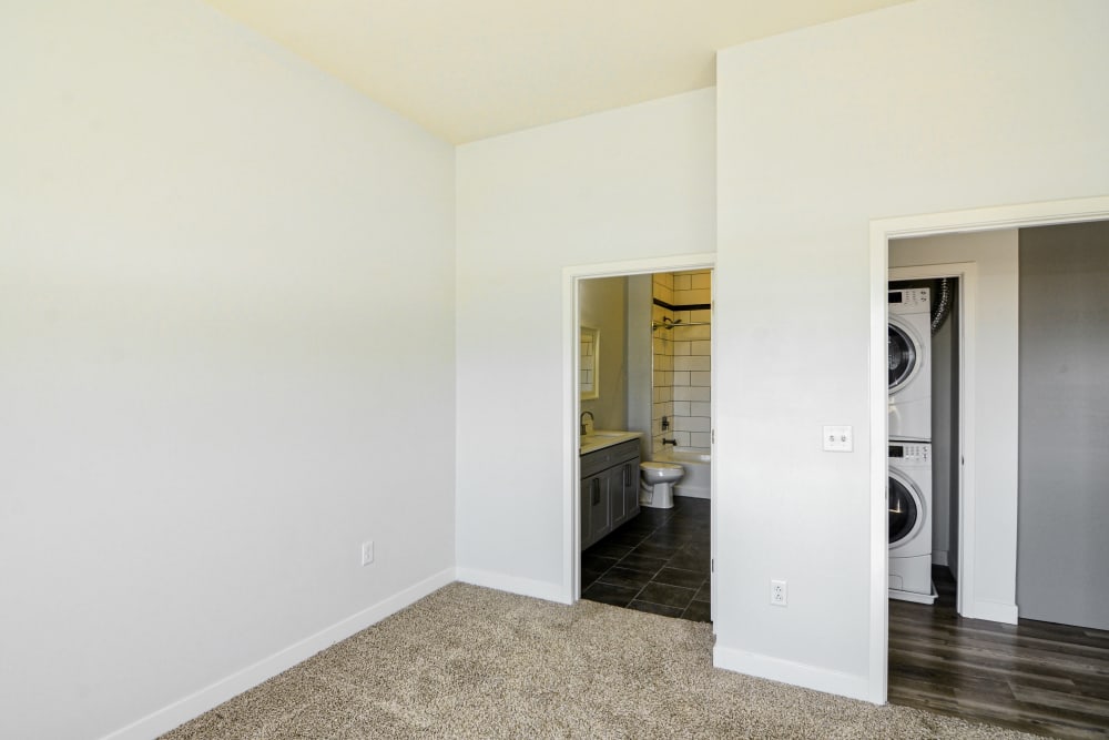 Bedroom with glimpse of Washer & Dryer at Steelyard Apartments in St. Louis, Missouri