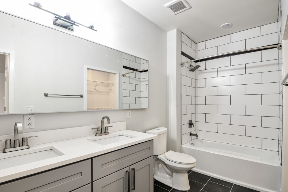 Bathroom with subway tile at Steelyard Apartments in St. Louis, Missouri