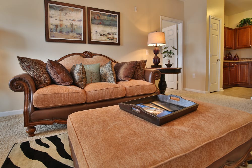 Spacious living room with plush carpeting at The Heights at McArthur Park in Fayetteville, North Carolina